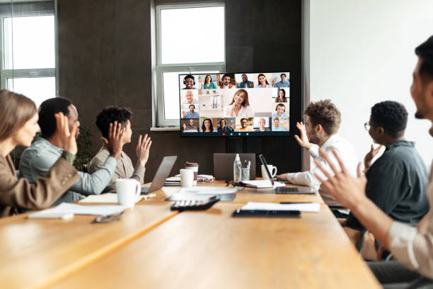 istock Diverse businesspeople making online video call to employees 1322853165