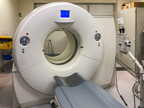 Living with Cancer: CT & PET scanners are critical instruments in keeping cancer patients alive through regular testing. A typical CT/PET scanner in an austere hospital room (ID & logo edited)