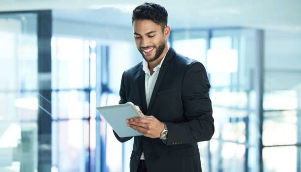 istock Shot of a young businessman using a digital tablet 1322853216