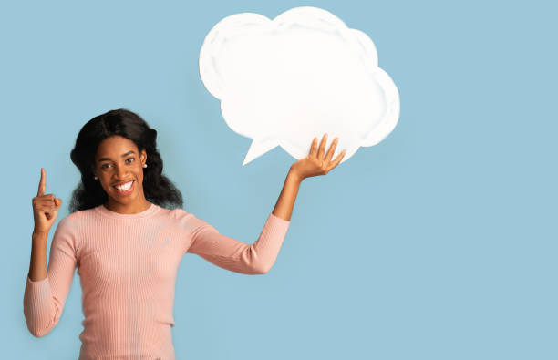 istock Idea Concept. Excited Black Woman Holding Speech Bubble And Pointing Finger Up 1322853280
