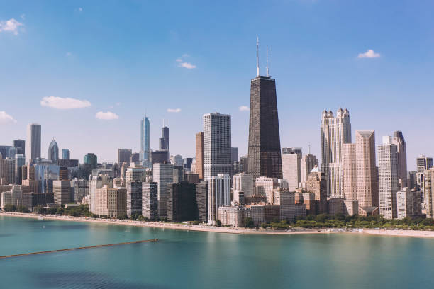 Aerial view of Chicago skyline with Michigan lake Aerial view of Chicago skyline with Michigan lake lake shore drive chicago stock pictures, royalty-free photos & images