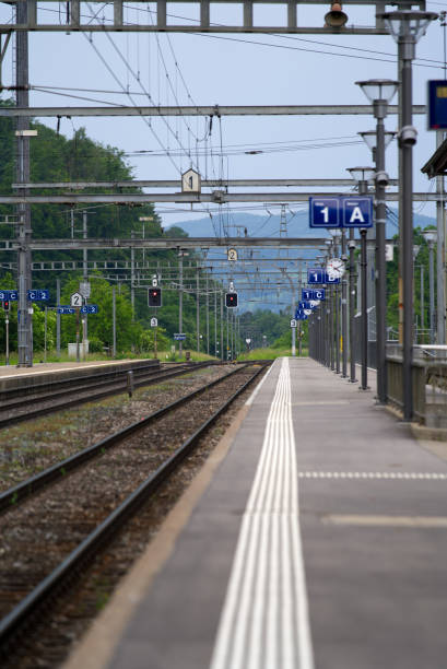 istock Empty platform at railway station Eglisau, canton Zurich, at summertime. 1322855092