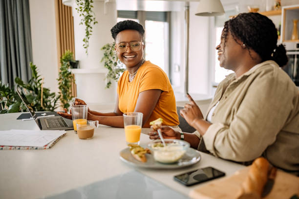 istock Two smiling woman working from their home office setup 1322857544