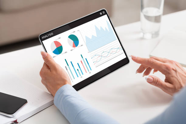 istock Cropped of woman using financial mobile application on digital tablet 1322857895