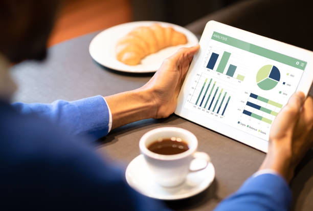 istock Unrecognizable black businessman analysing market on digital tablet 1322858293