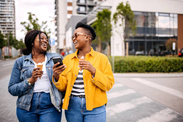 istock Friends enjoying ice cream in summer time 1322859301