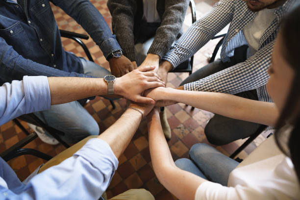 istock Top view of diverse people hands holding together in circle, hands stack 1322860837