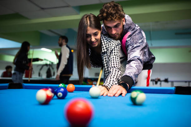 istock A good-looking young couple playing pool 1322861728