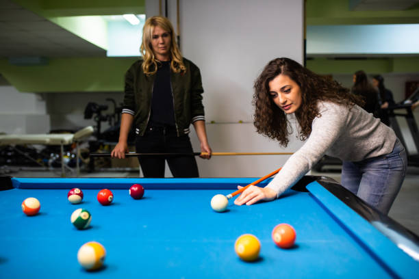 istock Friends playing snooker 1322861823