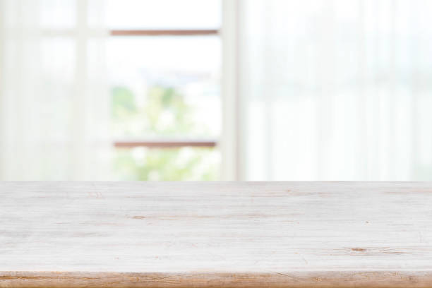 istock Table top for product display on blur curtained window view 1322862135