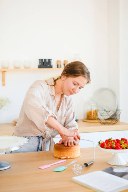 istock A pastry chef bakes a cake in the home kitchen. Home business. 1322862204