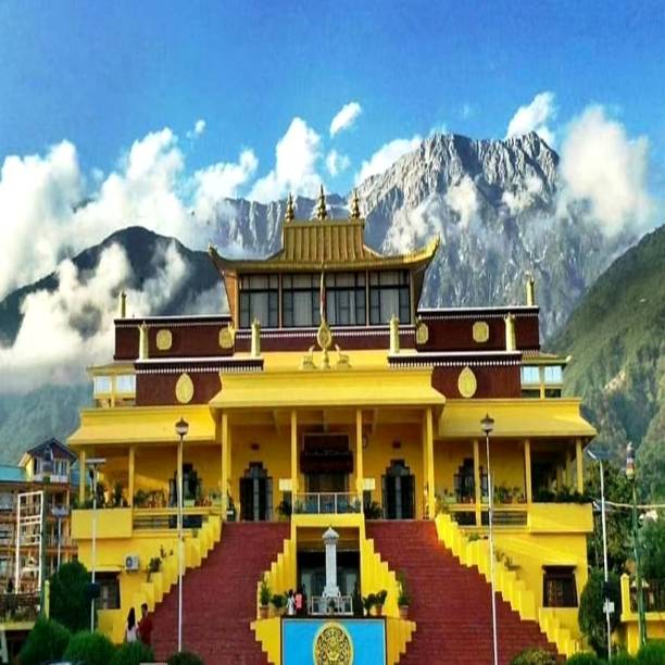 istock Monastery surrounded by mountains of himalaya and partially covered by cloud 1322864178