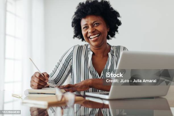 Happy Mature Woman Working At Home Office Stock Photo - Download Image Now - Women, One Woman Only, Working