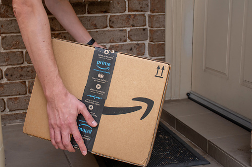 Sydney, Australia - 2020-03-08 Amazon prime boxdelivered to a front door of residential building.