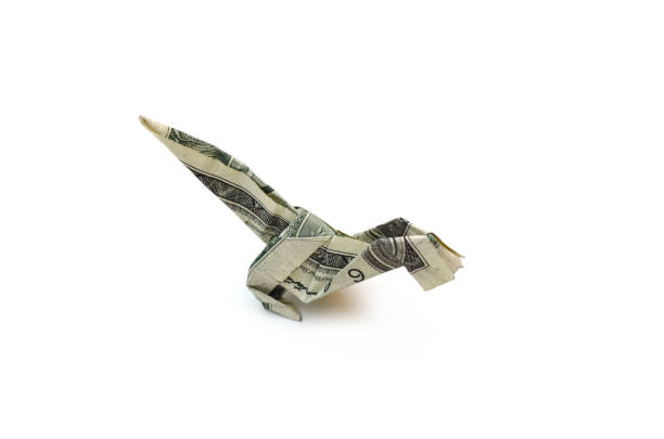 istock A dollar dinosaur origami on white 1322868686