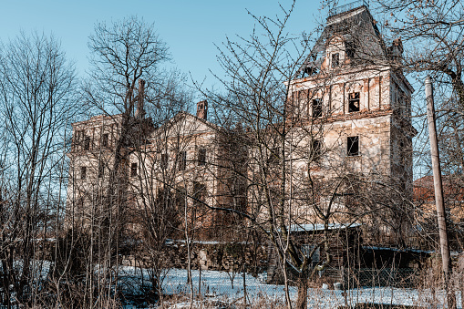 The abandoned ruins of a palace in the village of Stolec. The palace was built in the baroque style in the first half of the 18th century. At the end of the 19th century, the building was expanded, giving it a monumental form in the French neo-baroque style. Southwestern Poland.