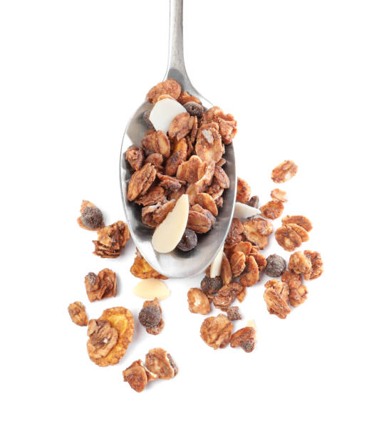 istock Spoon with granola on white background, top view. Healthy snack 1322871486