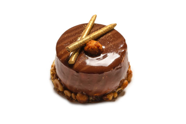 istock Chocolate and caramel cake isolated on a white background. 1322871529