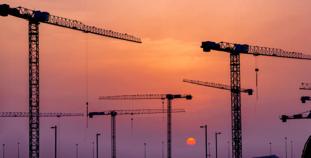 istock Crane and building construction site at sunset in Qatar 1322872193