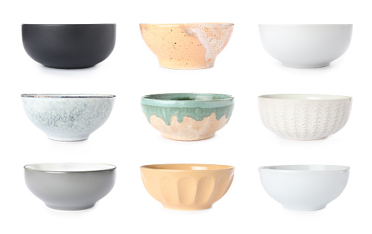 Set with empty ceramic bowls on white background