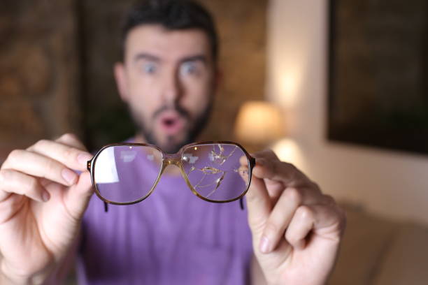istock Sad man with fragmented eyeglasses 1322873089
