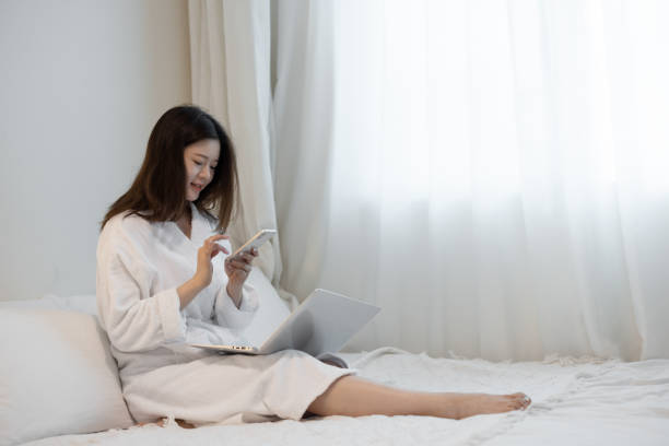 istock Asian women working from home in bathrobes 1322875053