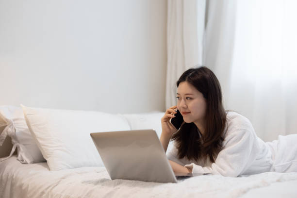istock Asian women working from home in bathrobes 1322875138