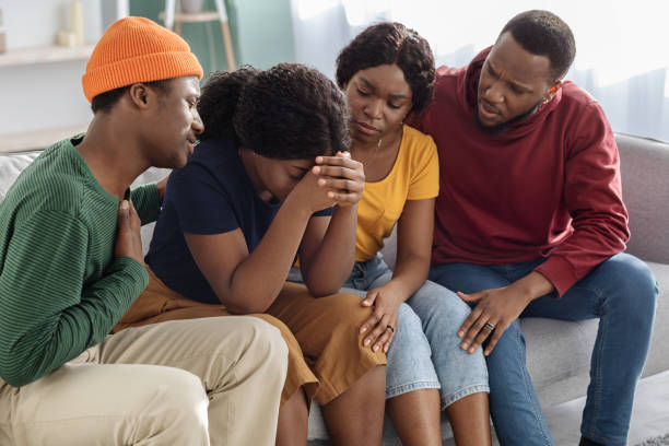istock Supportive black friends consoling their crying girlfriend 1322876634