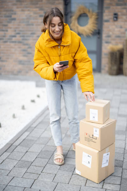 istock Woman receiving parcels purchased online 1322877047