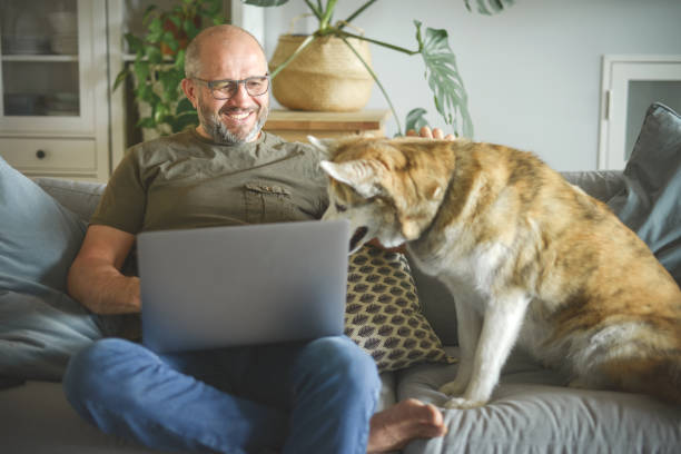 istock mature adult man working from home office ( with laptop) 1322877908