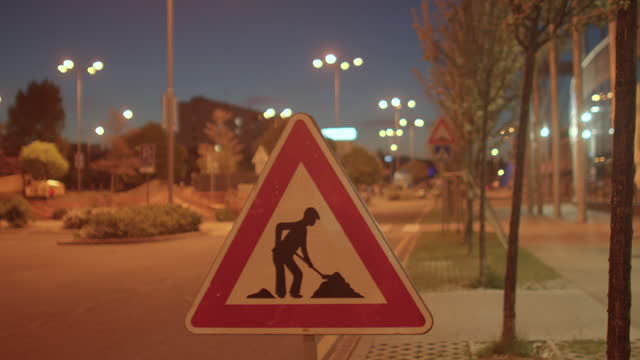 Road works sign in city. Attracting the attention of pedestrians and drivers.