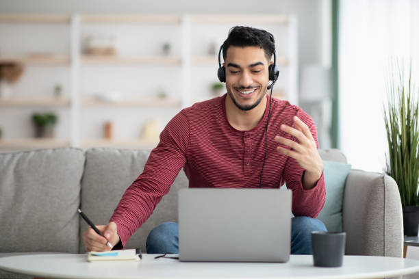 istock Excited arab guy attending online training from home 1322879393