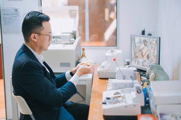 istock Optician optometrist wiping cleaning eyeglasses with microfiber towel 1322880016