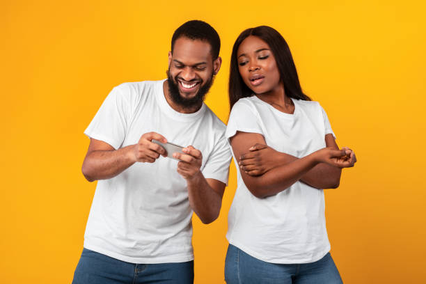 Boring Date. Excited Black Guy Playing Video Games and Ignoring Girlfriend  Next To Him Stock Image - Image of enjoy, conflict: 188745699