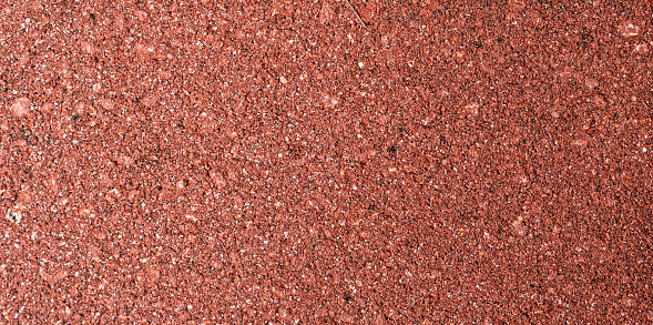 Small red gravel stones texture background