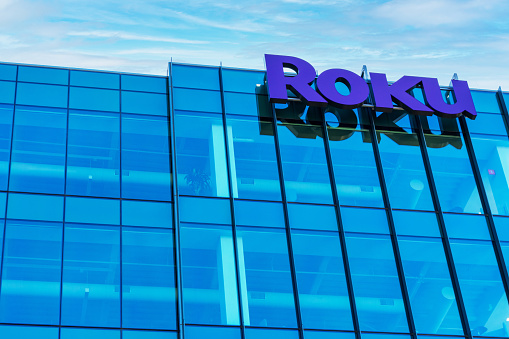 Roku sign and logo on the modern facade of consumer electronics and broadcast media company headquarters in Silicon Valley - San Jose, California, USA - 2021