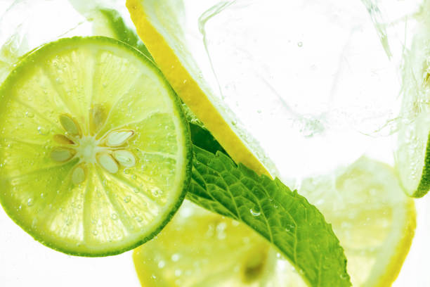 istock Lemon and line drop in fizzy sparkling water, juice refreshment 1322885822