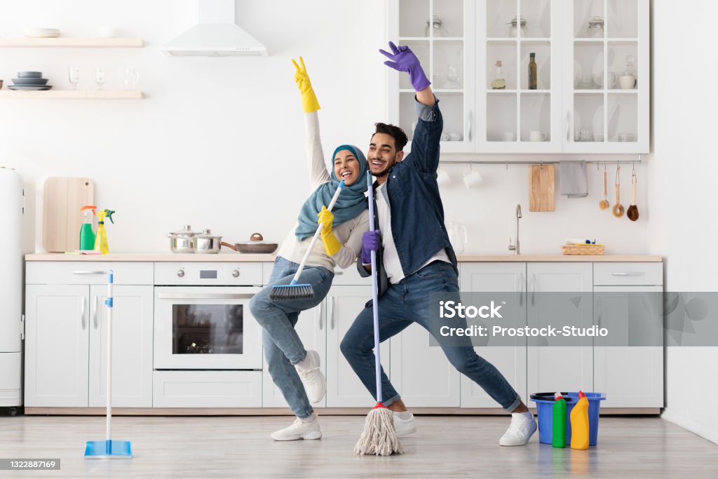 Funny Muslim Couple Singing Songs While Cleaning Kitchen Copy Space Stock  Photo - Download Image Now - iStock