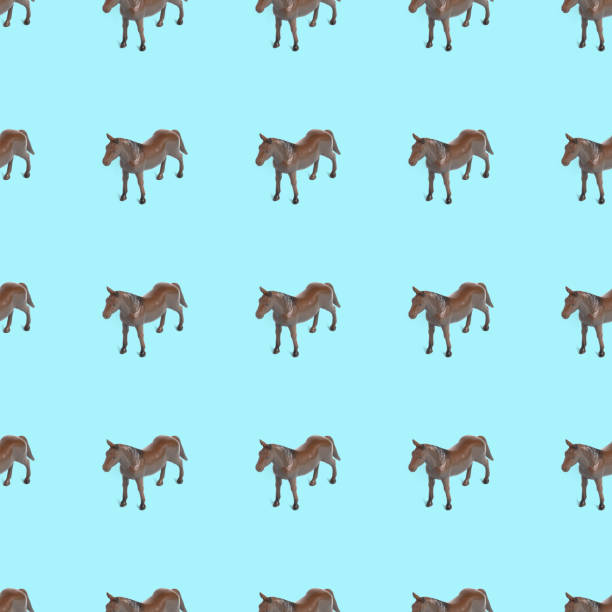 istock Seamless pattern photo of a horse on a blue background creative illustration. 1322887185