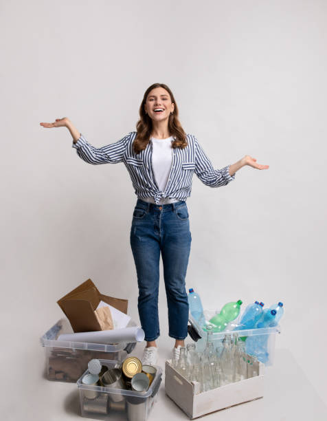 istock Waste Sorting. Millennial Lady Standing Among Containers With Different Materials For Recycling 1322889938