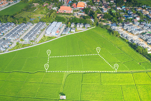 Land or landscape of green field in aerial view. Include agriculture farm, house building in village. That real estate or property. Plot of land for housing subdivision, development, owned, sale, rent, buy or investment in Chiang Mai of Thailand.