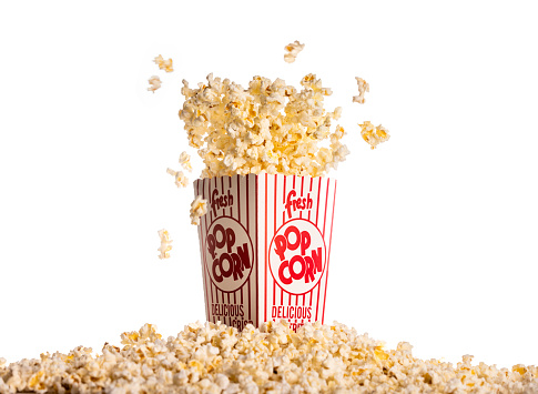 High quality stock photos of a box of movie theater popcorn bursting from the box.