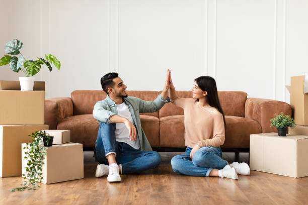 istock Happy man and woman giving high five 1322891149