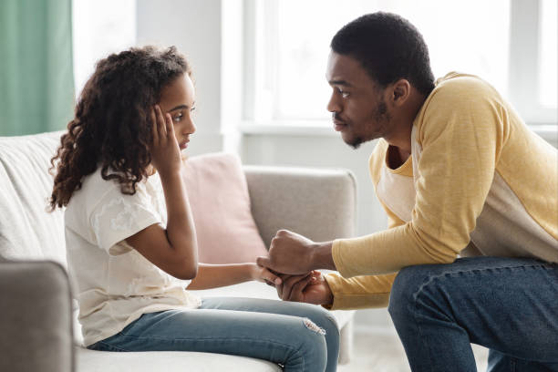 istock Black father comforting his upset kid, home interior 1322891253