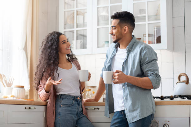 istock Millennial Middle Eastern Couple Spending Time In Kitchen, Drinking Coffee And Chatting 1322892001