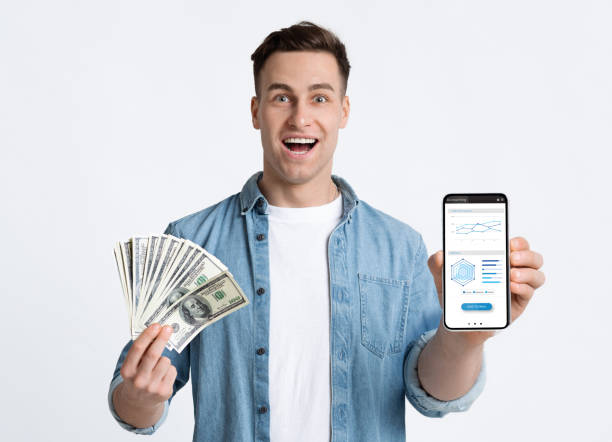 Emotional young man gambling online, showing prize