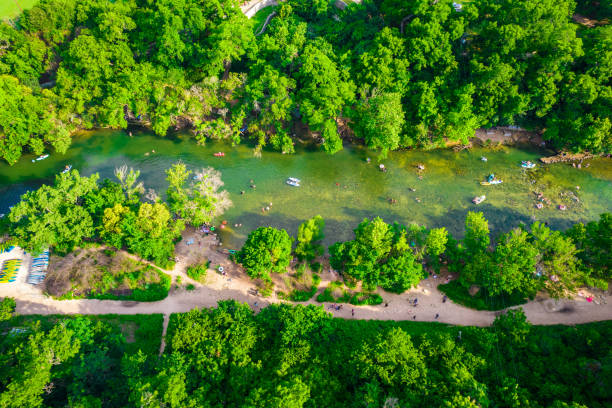 istock Top down drone angle above Green Lush Summer swim along Barton Springs 1322892692