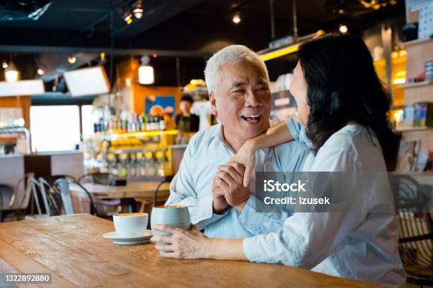 Senior Couple Enjoying Coffee In Cafe Stock Photo - Download Image Now - 60-69 Years, 70-79 Years, Adult