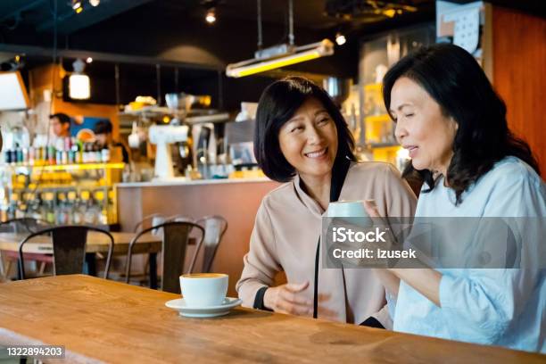Senior Friends Enjoying Coffee In Cafe Stock Photo - Download Image Now - 60-69 Years, 70-79 Years, Adult
