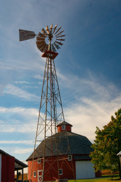 istock Windmill with Round Barn in the background-Howard County  Indiana 1322894871